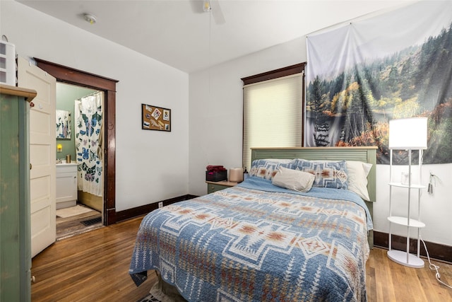 528 3rd Ave E, Kalispell, MT 59901 - bedroom with wood finished floors, ceiling fan, baseboards, and ensuite bath