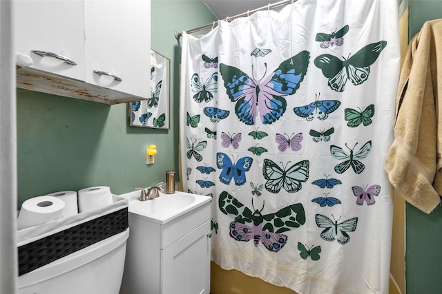 528 3rd Ave E, Kalispell, MT 59901 - bathroom featuring a shower with curtain, vanity, and toilet