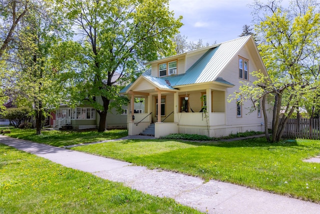 528 3rd Ave E, Kalispell, MT 59901 - view of front of home featuring covered porch and metal roof