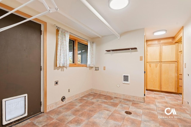 laundry room featuring hookup for an electric dryer, gas dryer hookup, baseboards, and heating unit