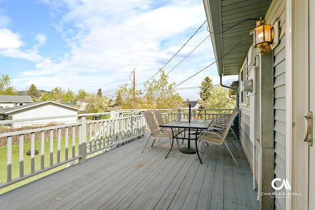wooden deck featuring outdoor dining space