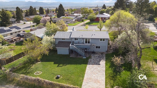 aerial perspective of suburban area with a mountainous background