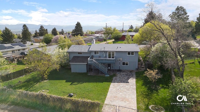 aerial view of property and surrounding area with a mountainous background