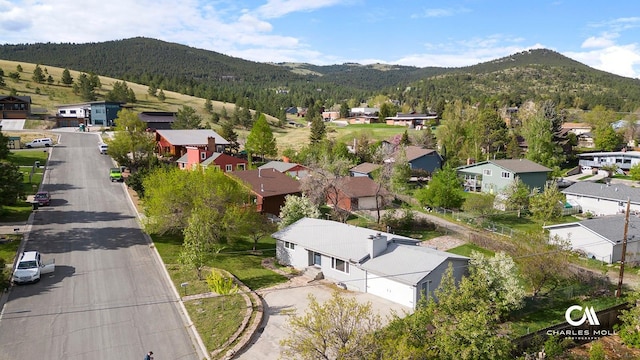 aerial view of residential area with mountains