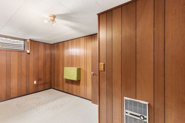 below grade area with wood walls and heating unit