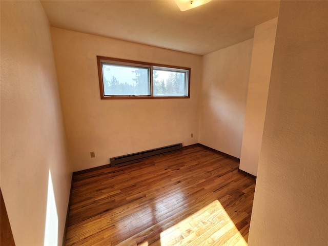172 Scenery Rd, Libby, MT 59923 - unfurnished room with baseboard heating and wood finished floors