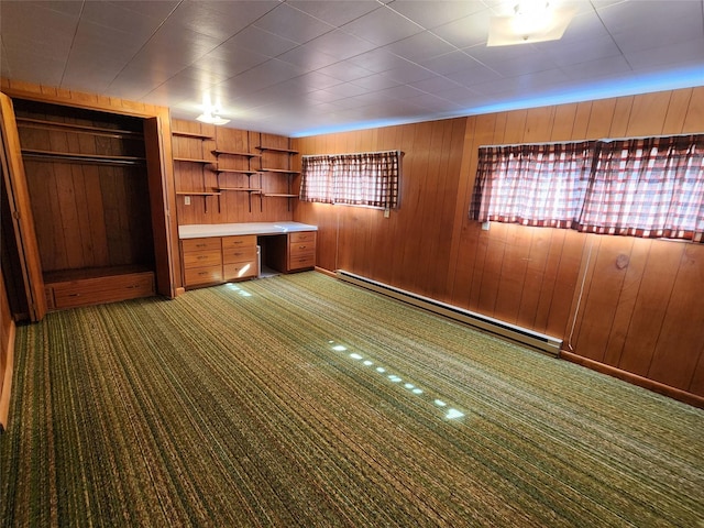 172 Scenery Rd, Libby, MT 59923 - interior space with a baseboard heating unit and wooden walls