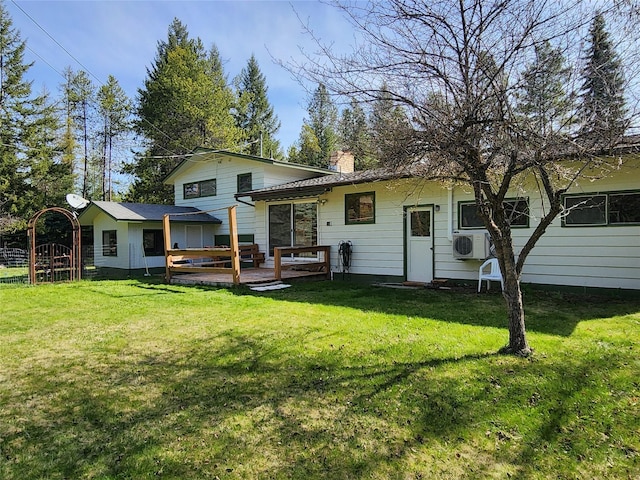 172 Scenery Rd, Libby, MT 59923 - rear view of property with a chimney, a lawn, a deck, and a cooling unit