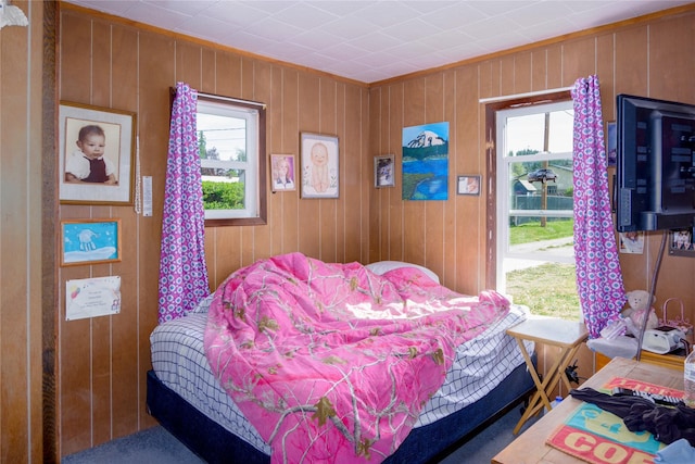1005 Idaho Ave, Libby, MT 59923 - bedroom with multiple windows and wooden walls