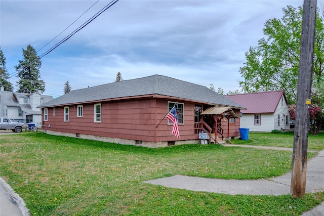 1005 Idaho Ave, Libby, MT 59923 - view of front facade with a front lawn and roof with shingles