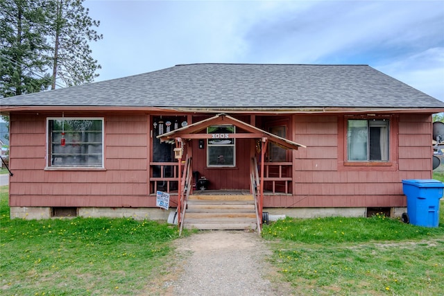 1005 Idaho Ave, Libby, MT 59923 - view of front of home with roof with shingles and a front yard