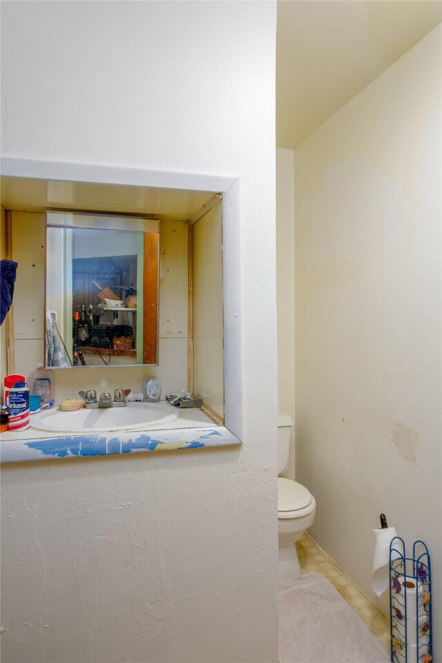 1005 Idaho Ave, Libby, MT 59923 - bathroom with toilet and a sink