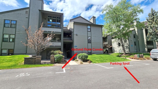 270 Bridge St Unit Qc1-103, Bigfork, MT 59911 - view of property with uncovered parking