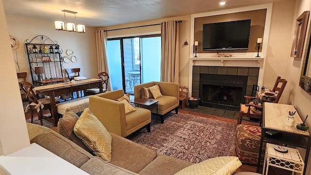 270 Bridge St Unit Qc1-103, Bigfork, MT 59911 - living room with a tile fireplace, wood finished floors, and recessed lighting