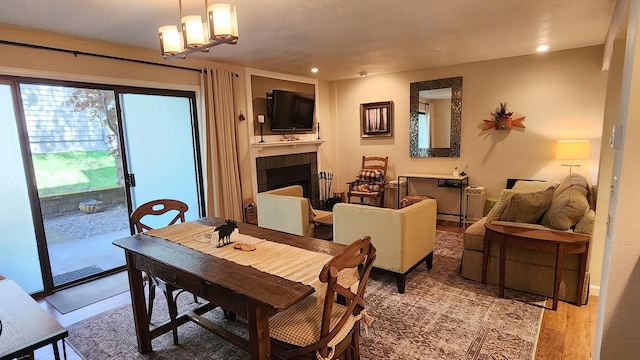 270 Bridge St Unit Qc1-103, Bigfork, MT 59911 - dining area featuring a tile fireplace and recessed lighting