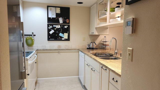 270 Bridge St Unit Qc1-103, Bigfork, MT 59911 - kitchen featuring white appliances, light stone countertops, open shelves, and white cabinets