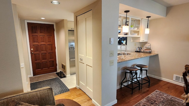 270 Bridge St Unit Qc1-103, Bigfork, MT 59911 - entryway featuring wood finished floors and recessed lighting