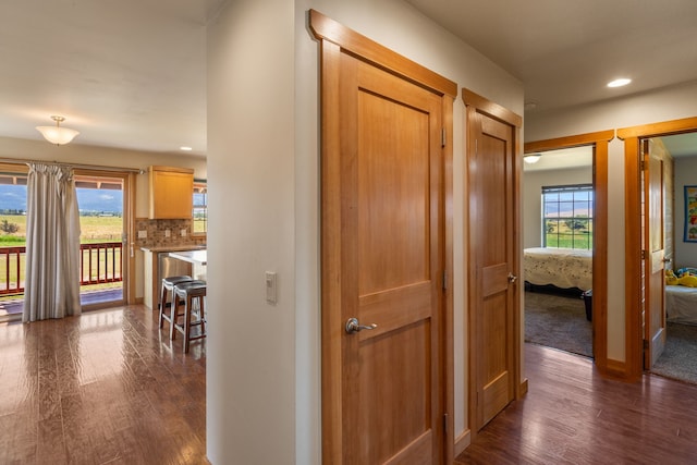 61253 Watson Rd, Saint Ignatius, MT 59865 - corridor featuring dark wood finished floors, recessed lighting, and baseboards