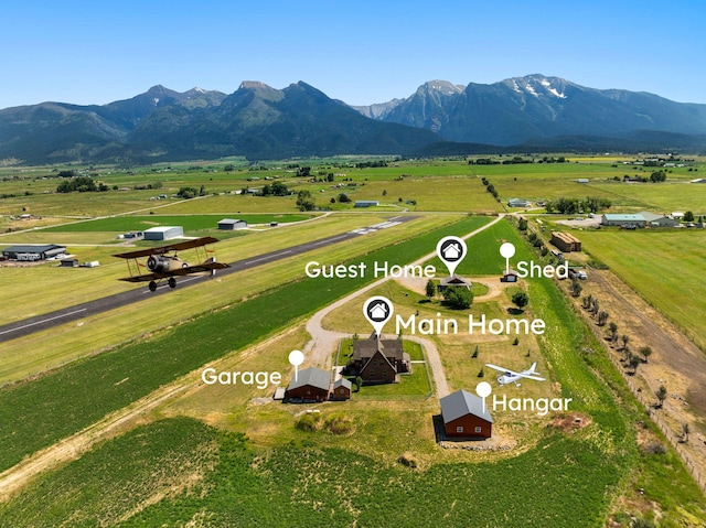 61253 Watson Rd, Saint Ignatius, MT 59865 - overview of rural landscape featuring a mountainous background and agricultural land
