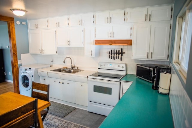 kitchen featuring white electric range oven, a sink, tasteful backsplash, and white cabinets