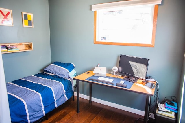 bedroom with wood-type flooring, a desk, and baseboards