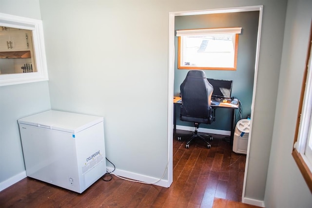 office featuring dark wood-style flooring and baseboards