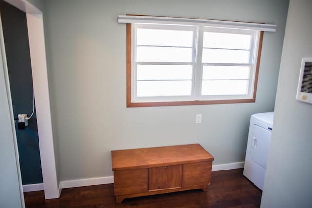 clothes washing area featuring washer / dryer, baseboards, and dark wood finished floors