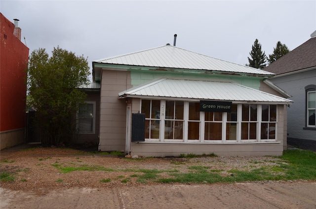 218 W Broadway St, Philipsburg, MT 59858 - back of property featuring a sunroom and a metal roof