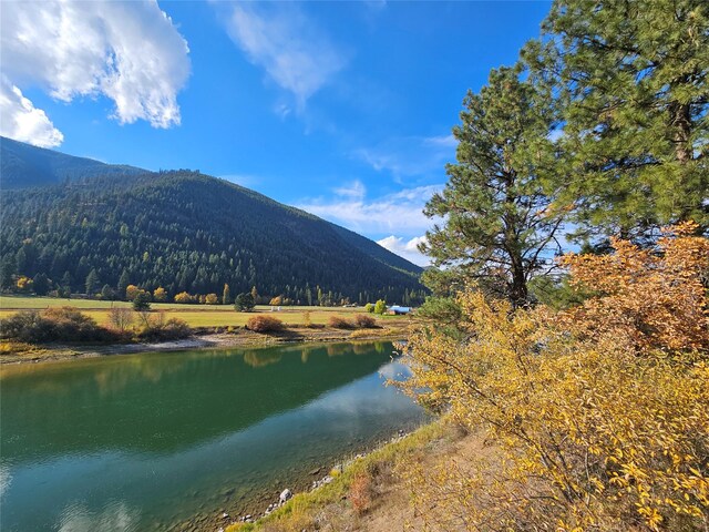 4743 Sloway Frontage Rd, Superior, MT 59872 - water view featuring a mountainous background and a heavily wooded area