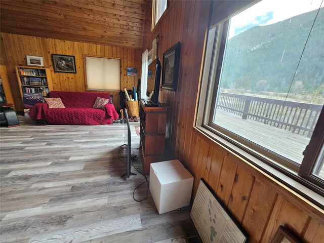 4743 Sloway Frontage Rd, Superior, MT 59872 - living area with plenty of natural light, wooden walls, light wood finished floors, and high vaulted ceiling