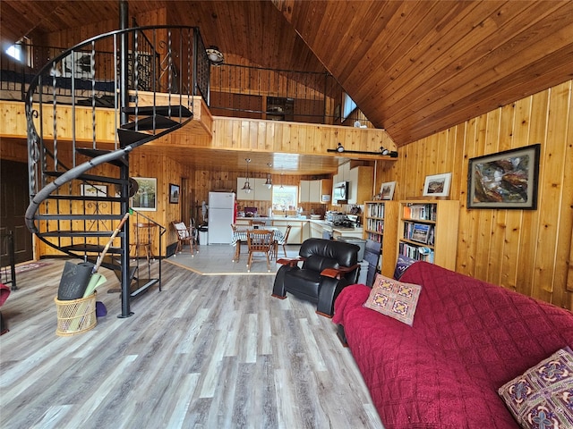 4743 Sloway Frontage Rd, Superior, MT 59872 - living area featuring wood walls, light wood finished floors, high vaulted ceiling, and wooden ceiling