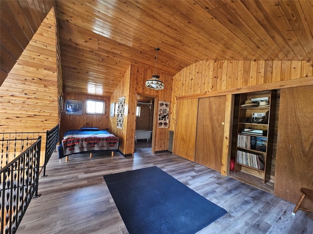 4743 Sloway Frontage Rd, Superior, MT 59872 - bedroom featuring wood walls, lofted ceiling, wood finished floors, and wooden ceiling
