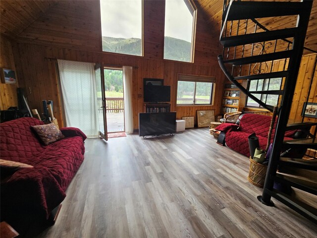 4743 Sloway Frontage Rd, Superior, MT 59872 - living room with high vaulted ceiling, wood walls, wood finished floors, and wood ceiling