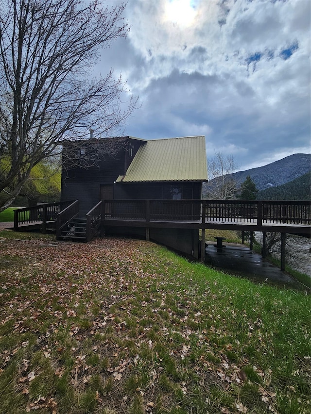 4743 Sloway Frontage Rd, Superior, MT 59872 - view of side of home featuring a deck with mountain view and metal roof