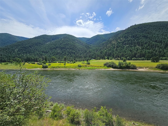 4743 Sloway Frontage Rd, Superior, MT 59872 - view of mountain background featuring a forest and a large body of water