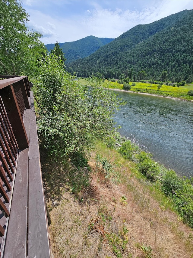 4743 Sloway Frontage Rd, Superior, MT 59872 - water view featuring a heavily wooded area and a mountainous background