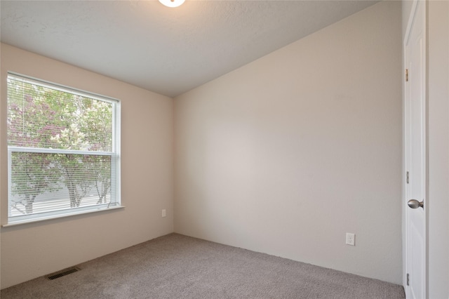 empty room featuring carpet flooring