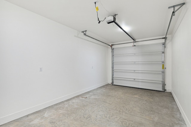 garage with baseboards and a garage door opener