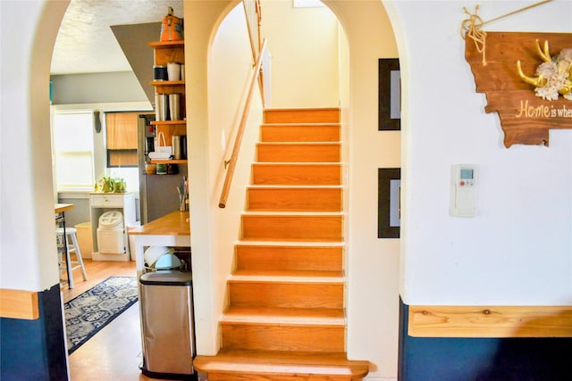1314 Dakota Ave, Libby, MT 59923 - staircase featuring arched walkways
