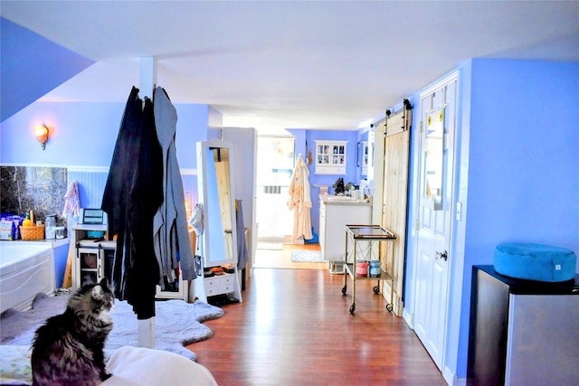 1314 Dakota Ave, Libby, MT 59923 - hallway with wood finished floors and a barn door