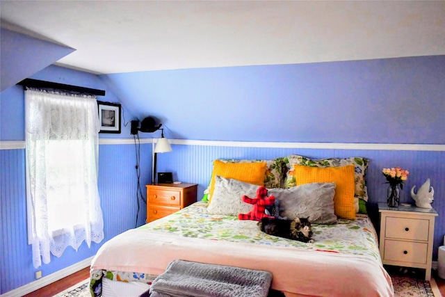 1314 Dakota Ave, Libby, MT 59923 - bedroom with vaulted ceiling, wood finished floors, and baseboards