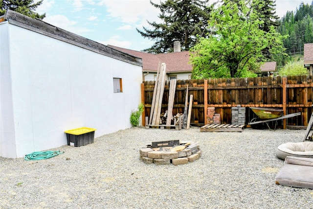 1314 Dakota Ave, Libby, MT 59923 - view of yard featuring a fire pit and fence
