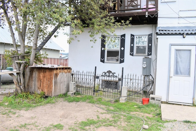 1314 Dakota Ave, Libby, MT 59923 - view of front of home featuring stucco siding and fence