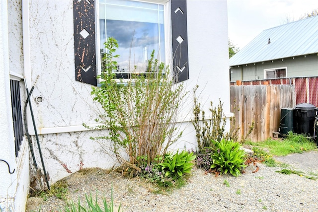 1314 Dakota Ave, Libby, MT 59923 - view of side of property with fence and stucco siding