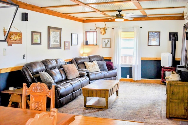 1314 Dakota Ave, Libby, MT 59923 - living room featuring ceiling fan, wood finished floors, and a wall unit AC