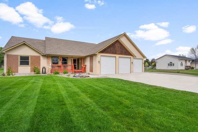 1815 Homestead Dr, Missoula, MT 59808 - ranch-style home featuring a porch, concrete driveway, a garage, a front yard, and a shingled roof