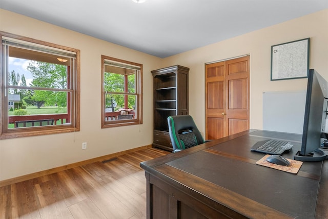 1815 Homestead Dr, Missoula, MT 59808 - home office with baseboards and light wood-style flooring