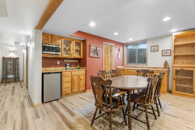 1815 Homestead Dr, Missoula, MT 59808 - dining space with bar with sink, light wood finished floors, recessed lighting, and baseboards
