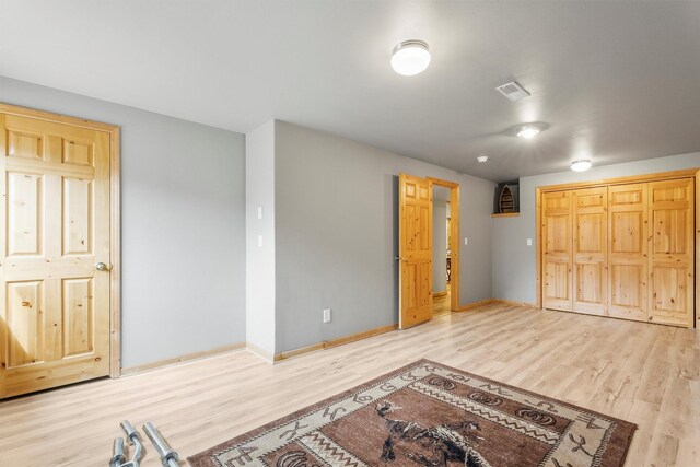 1815 Homestead Dr, Missoula, MT 59808 - unfurnished bedroom with wood finished floors and baseboards