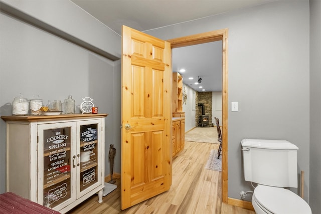 1815 Homestead Dr, Missoula, MT 59808 - bar featuring wood finished floors, a wood stove, and baseboards